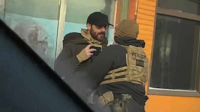 A still image of Alex Pretti recording video on his phone as he was shoved back by a federal agent minutes before being shot and killed.
