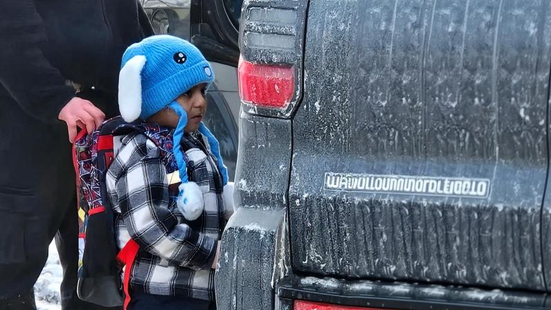 Liam Ramos, five, detained by ICE in Columbia Heights, Minnesota, outside of his home on Tuesday.
