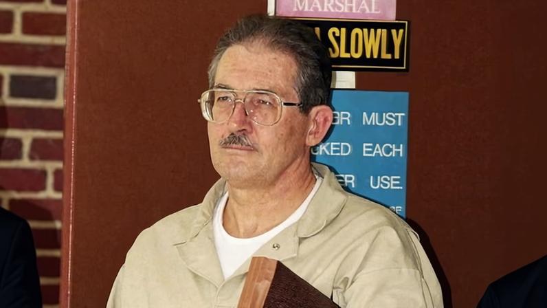 Aldrich Ames leaves federal court after pleading guilty to espionage and tax evasion conspiracy charges in 1994, in Alexandria, Virginia.