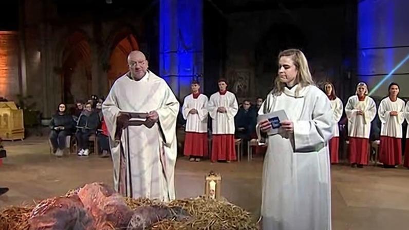 The 'slime' Jesus was played by a performance artist writhing in a manger of hay before the priests and choir