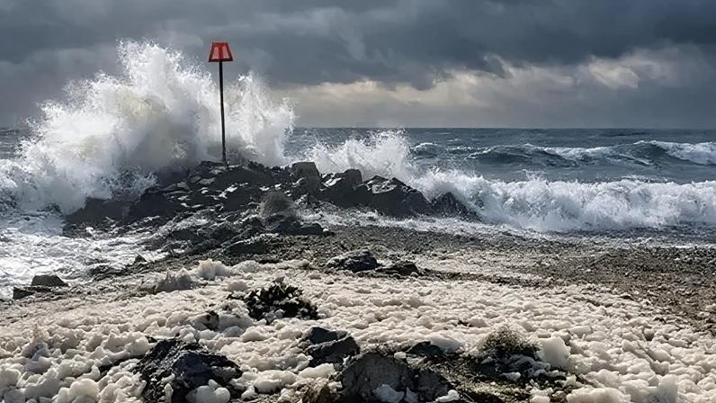 Highcliffe, Christchurch Dorset - beach with large waves crashing in
