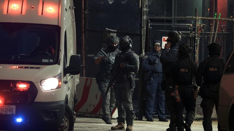 DEA agents operate outside a helipad, before Venezuela's President Nicolas Maduro and his wife Cilia Flores arrive in custody from a helicopter before their scheduled court appearance at Manhattan federal court, at the Downtown Manhattan Heliport in New York City, U.S. January 3, 2026. REUTERS/Jeenah Moon