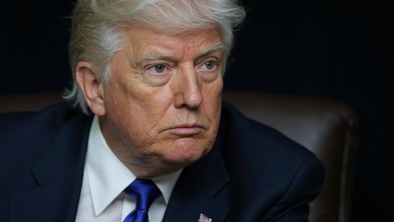 FILE PHOTO: U.S. President Donald Trump looks on as he signs executive orders and proclamations in the Oval Office at the White House, in Washington, D.C., U.S., May 5, 2025. REUTERS/Leah Millis/File Photo