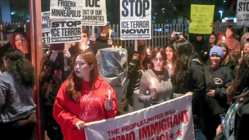 People gather outside the Phoenix ICE Field Office on Jan. 7, 2026, for a vigil in honor of Renee Nicole Good, who was shot and killed by an ICE agent in Minneapolis.