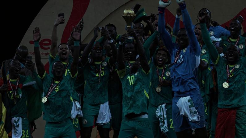 Senegal's Sadio Mane lifts the trophy with teammates as they celebrate after winning the Africa Cup of Nations