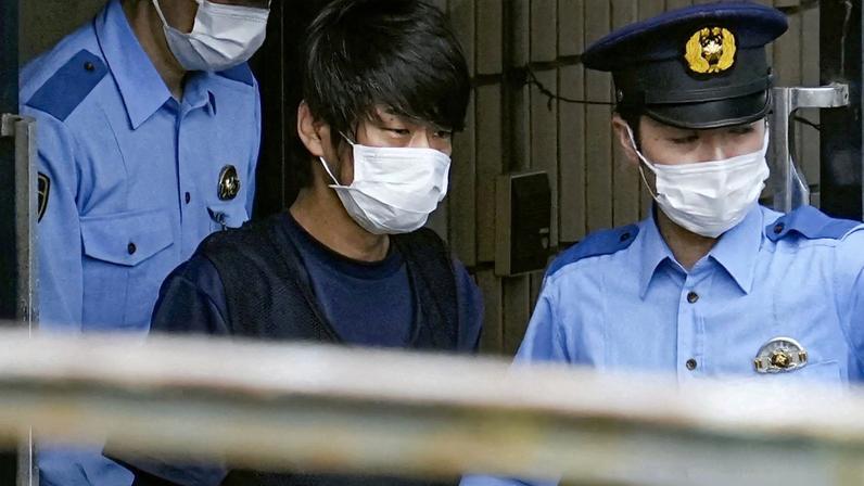 Tetsuya Yamagami, suspected of killing former Japanese premier Shinzo Abe, is escorted by police officers as he is taken to prosecutors, at Nara-nishi police station in Nara, western Japan, in this photo taken by Kyodo July 10, 2022. Mandatory credit Kyodo via REUTERS