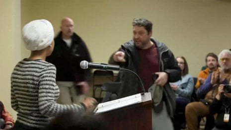 Security tackles man who sprayed unidentified liquid on Ilhan Omar at town hall – video