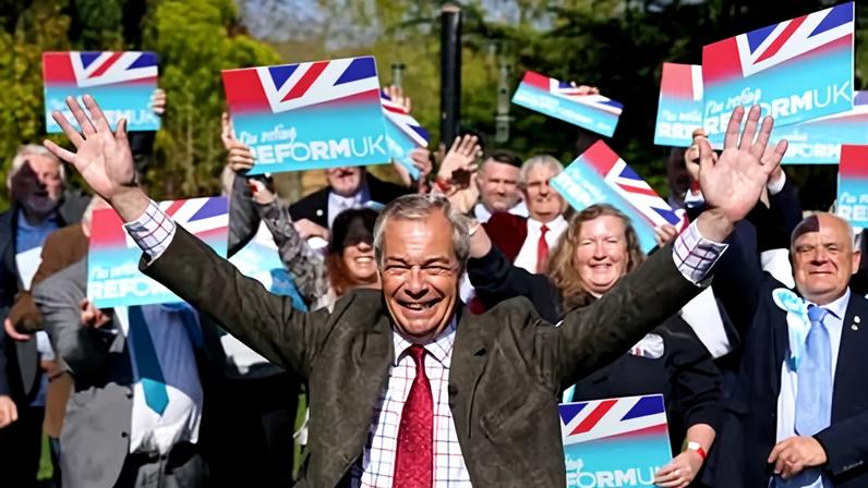 Nigel Farage campaigning with Reform UK party candidates for local elections in Ripley, Derbyshire, in April 2025.