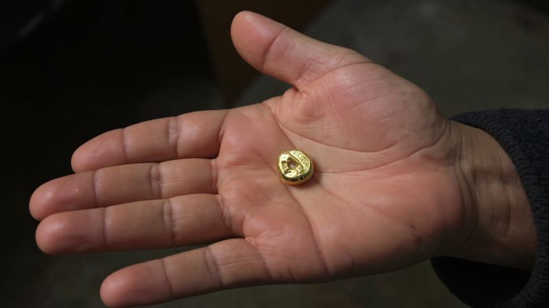 After burning off the mercury, a relatively pure piece of gold remains. Image by Thomas Graham for Mongabay.