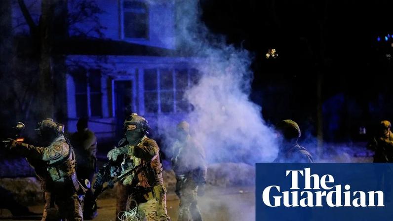 Federal immigration officers shoot pepper balls as teargas is deployed at the scene of a shooting in Minneapolis yesterday.