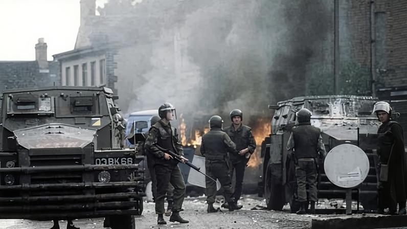 British troops surround a blazing barricade near the Andersonstown police station in Belfast, 1979. Veterans accused of wrongdoing during the Troubles had been granted conditional immunity.