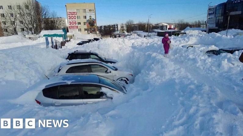 Cars deep in snow