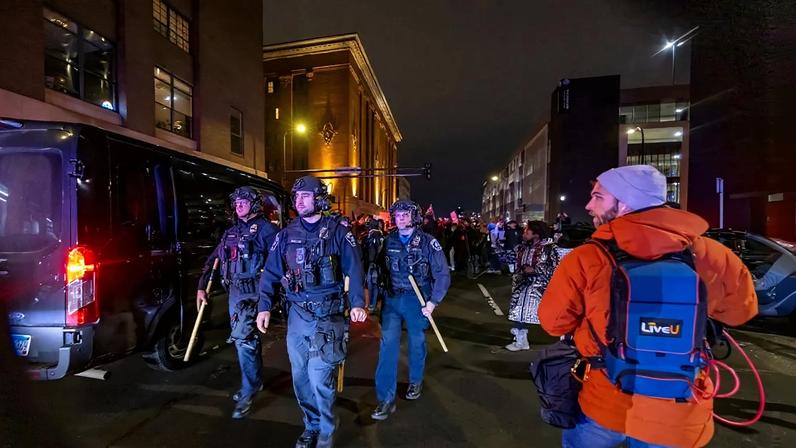 Demonstrators make noise outside of hotels thought to house U.S. Immigration and Customs Enforcement and other federal agents in Minneapolis on Jan 9.