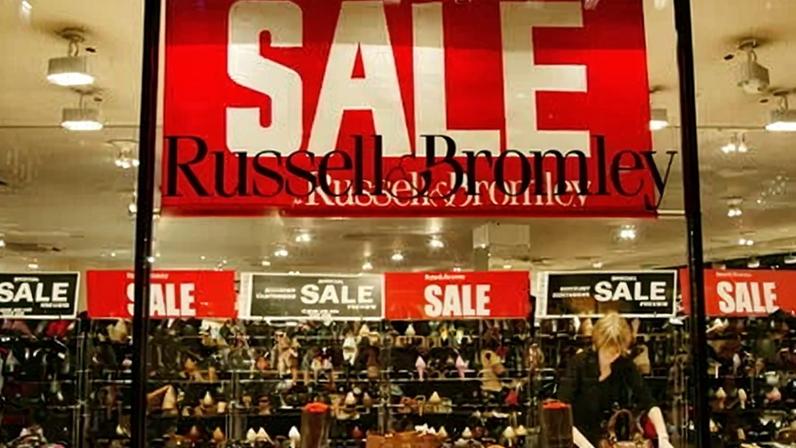 Winter sale signs at a Russell & Bromley shoe shop window in London. Picture taken in 2015.