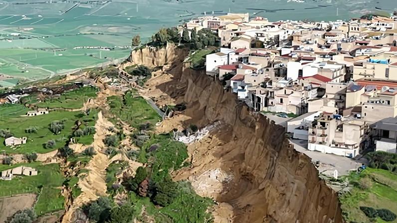 Hillside showed signs of movement on Sunday before developing into dramatic chasm, which continues to widen.