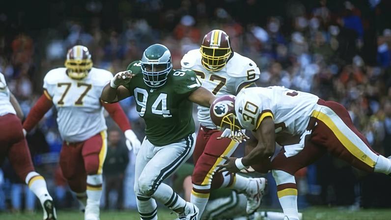 Defensive lineman Kevin Johnson of the Philadelphia Eagles moves down the field during a game against Washington in 1995.
