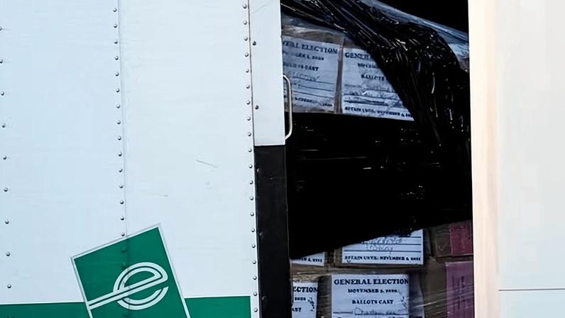 Georgia general election 2020 ballots are loaded by the FBI onto trucks at the Fulton county election hub on Wednesday, in Union City, Georgia, near Atlanta.