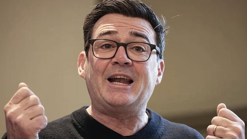 Andy Burnham clenching his fists as he speaks