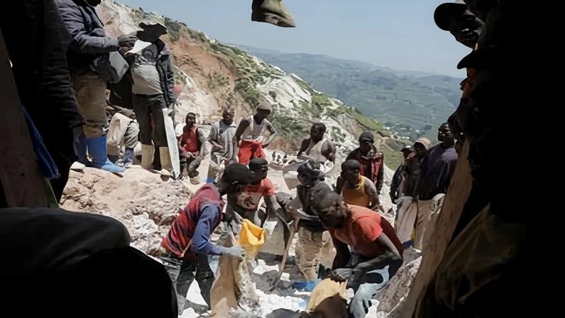 Miners work at the entrance of a shaft at the SMB coltan mine near the town of Rubaya in the Eastern Democratic Republic of Congo.