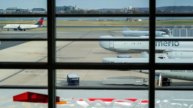 American Airlines flights stage at Ronald Reagan Washington National Airport as the Trump administration warns of impending cuts to commercial airline operations more than a month into the US government shutdown in Arlington, Virginia, U.S., November 7, 2025.