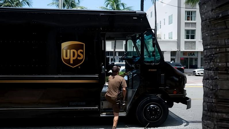 A UPS driver makes a delivery in Miami, Florida, on 30 June 2023.