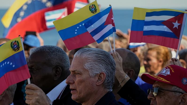 The Cuban president, Miguel Díaz-Canel (centre), attends a rally in Havana on Saturday after the US’s capture of Nicolás Maduro.