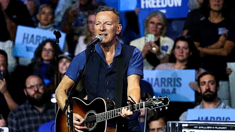 Bruce Springsteen performs during a campaign rally for Kamala Harris.