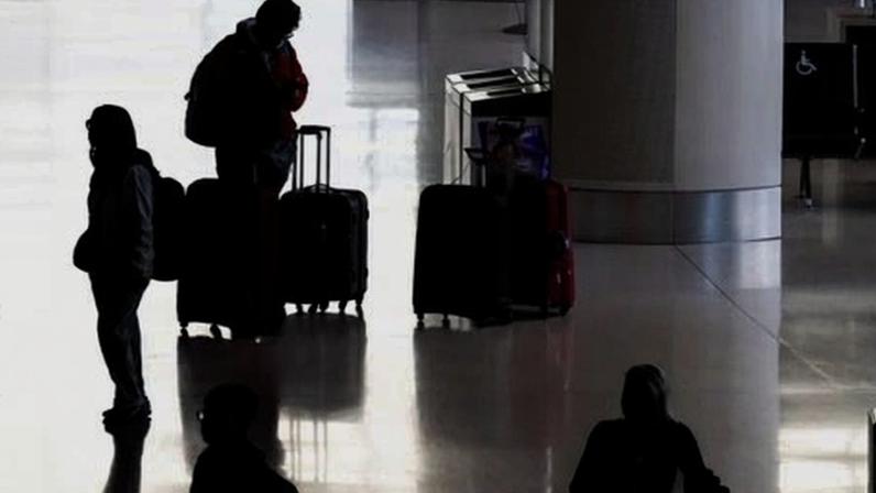 Travelers at San Francisco International Airport on 25 November 2025.