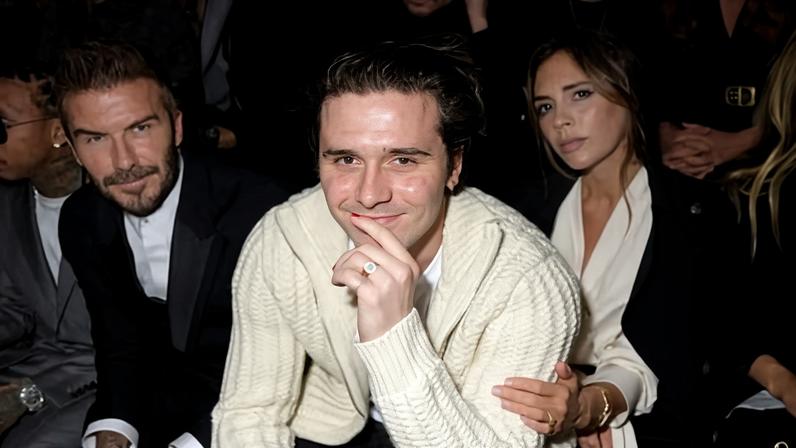 Brooklyn Beckham, with parents David and Victoria, at Paris Fashion Week, 17 January 2020.