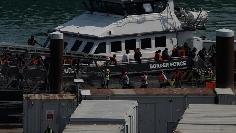A UK Border Force vessel brings people into Dover port who were intercepted crossing the Channel.