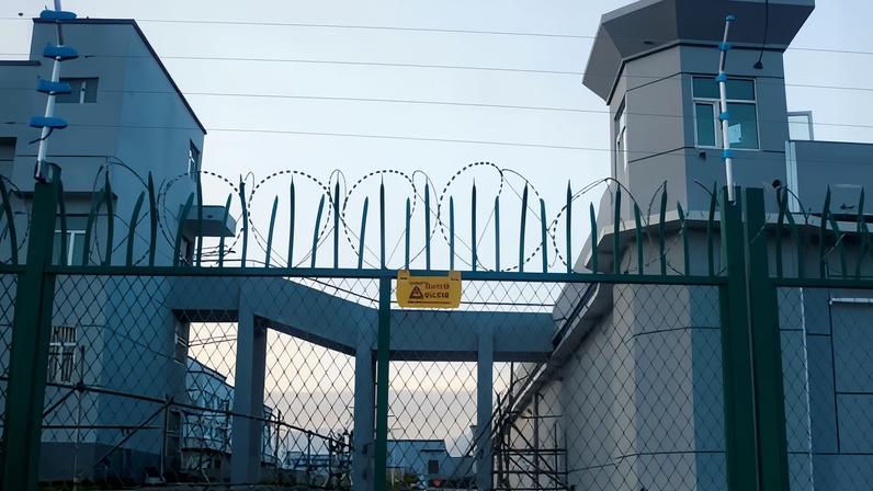 The gates to what is officially known in China as a vocational skills education centre in Dabancheng in Xinjiang. Guan Heng has been granted asylum in the US after filming secret detention facilities holding Uyghurs in the Chinese region.