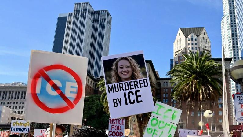 Activists protest the shooting death of Renee Good in Minneapolis at Pershing Square in Los Angeles, California, on Saturday.
