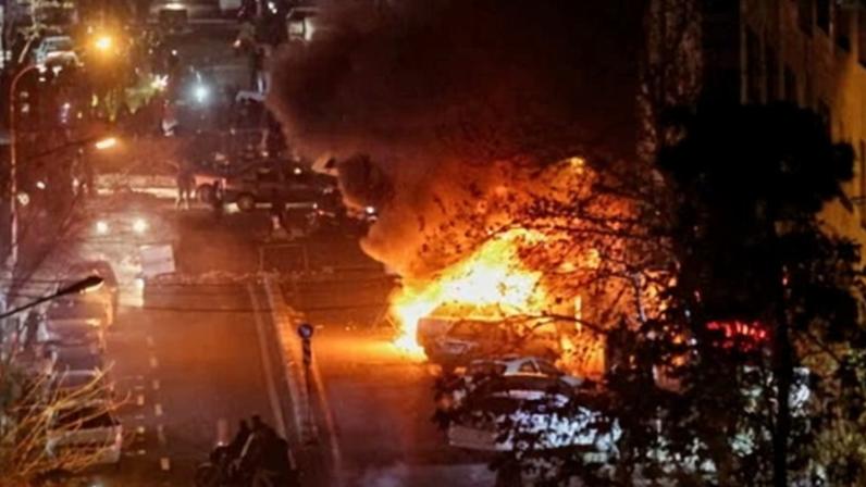 Cars burn during a protest in Tehran last week.