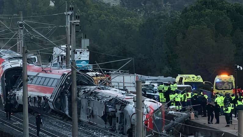 Members of the Spanish civil guard and other emergency personnel work at the site of a deadly derailment of two high-speed trains near Adamuz.