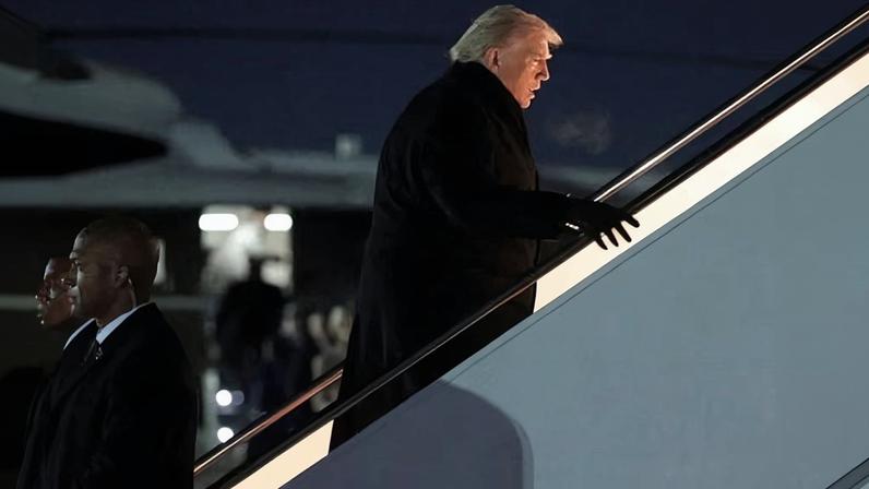 US president Donald Trump boards Air Force One for travel to the World Economic Forum in Davos, Switzerland, from Joint Base Andrews. The plane later returned to Washington.