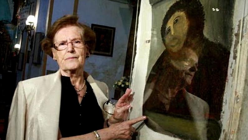 Cecilia Gimenez beside her restoration called Ecce Home