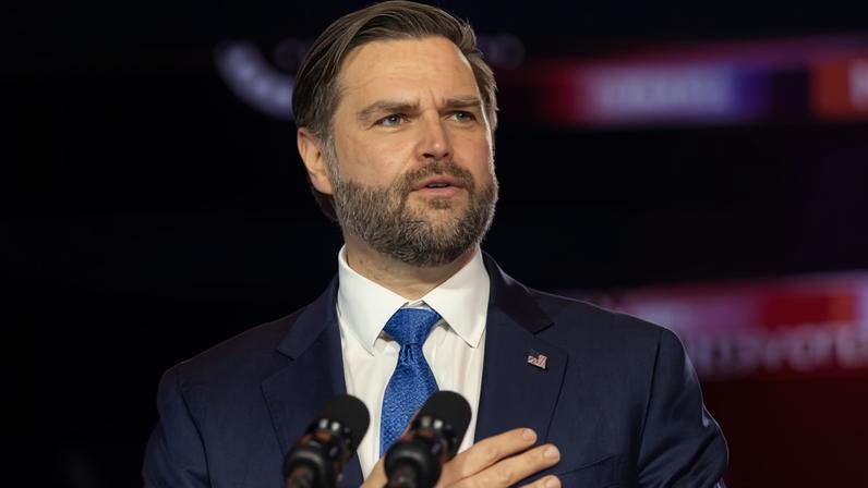 JD Vance speaks during Turning Point USA's AmericaFest 2025 in Phoenix.