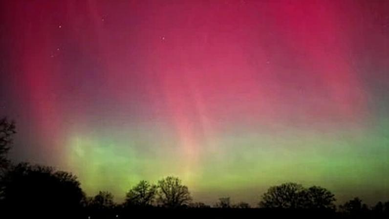 The aurora borealis, also known as the ‘northern lights’ illuminates the sky over Quickborn, northern Germany, on Monday.