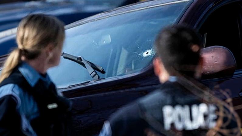 A bullet hole is seen in a vehicle after a woman in Minnesota was shot and killed by an ICE agent during a raid on 7 January.