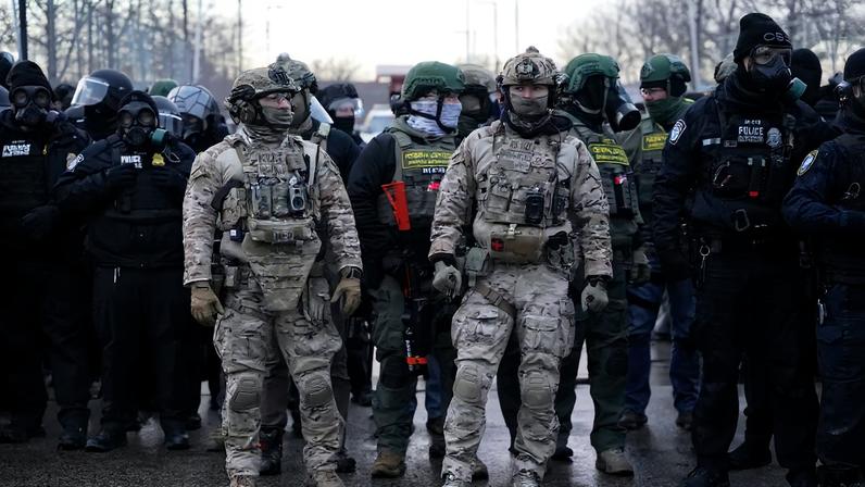 Members of U.S. Customs and Border Protection (CBP) and other law enforcement officials stand guard, in front of the Bishop Henry Whipple Federal Building, during a protest more than a week after an ICE agent fatally shot Renee Nicole Good, in Minneapolis, Minnesota, U.S., January 17, 2026. REUTERS/Seth Herald