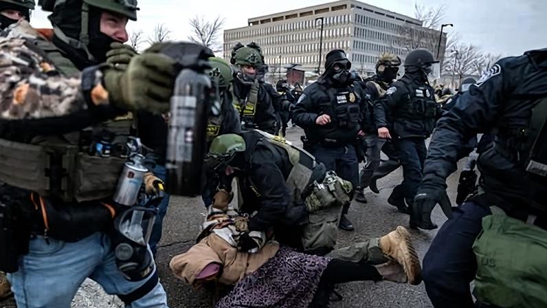 Federal law enforcement officers detain a protester during a protest in Minnesota, on 17 January 2026.