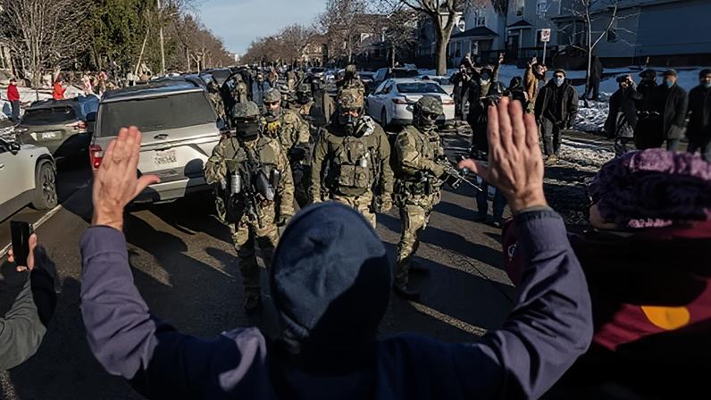 Demonstrators confront federal law enforcement agents in south Minneapolis, Minnesota, on 13 January.