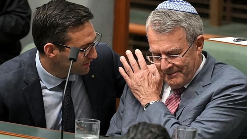 Labor MP Josh Burns consoled the attorney-general, Mark Dreyfus, after speaking on the condolence motion during a federal parliament.