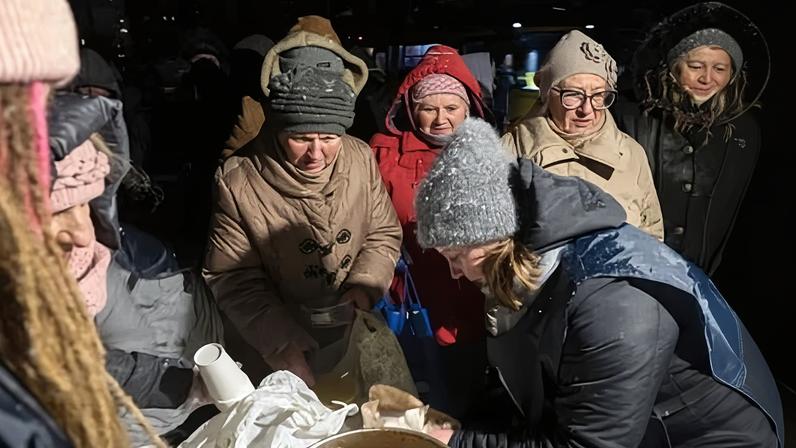 Volunteers distribute hot meals to those in need in Kyiv as Russia continues to attack Ukraine’s energy system during the winter.