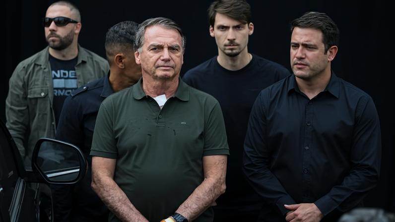 Former Brazilian president Jair Bolsonaro, centre, once said that he didn’t have time to read.