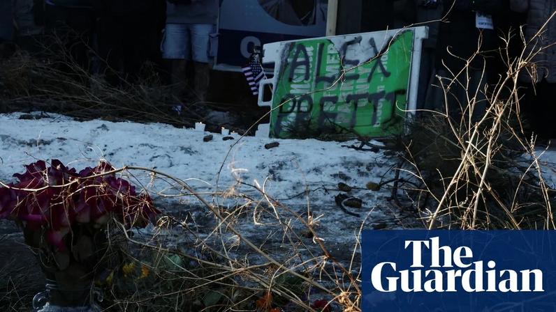 People leave signs, flowers and candles at a site where Alex Pretti was fatally shot in Minneapolis, Minnesota.