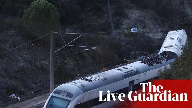 Members of the Spanish Civil Guard work next to one of the trains involved in the accident