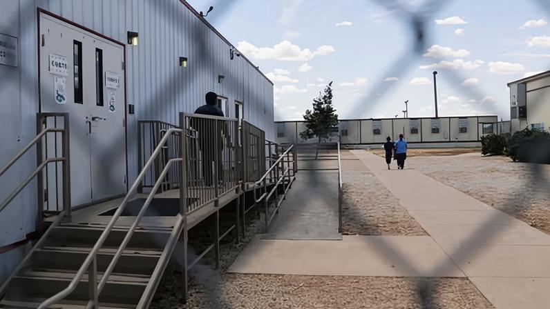Immigrants seeking asylum walk through the ICE south Texas family residential center in Dilley, Texas.