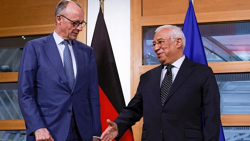The German chancellor, Friedrich Merz (L), greets the European Council president, António Costa, ahead of an informal meeting of the European Council in Brussels.