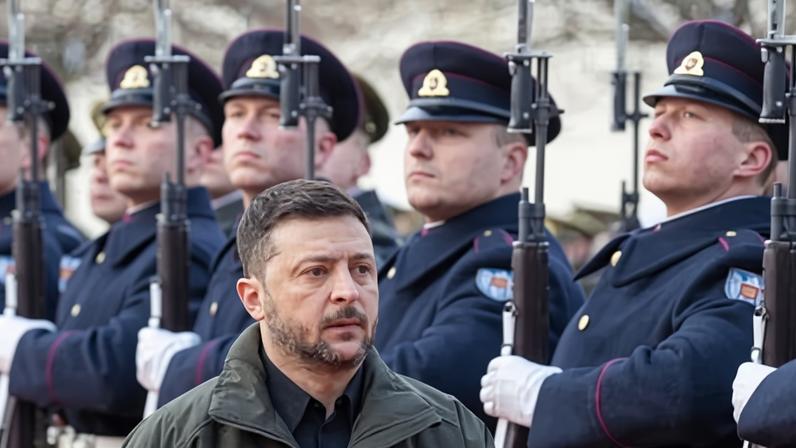 Volodymyr Zelenskyy reviews a guard of honour on a trip to Lithuania on Sunday